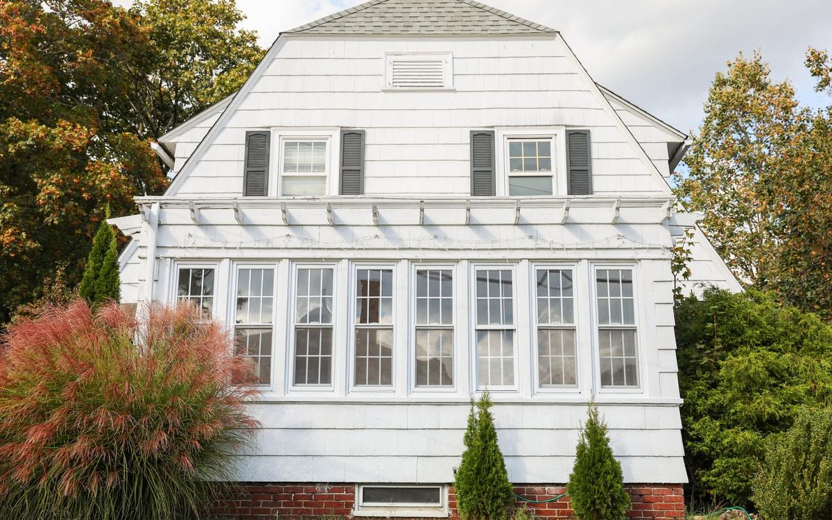 Colonial-style New England home with painted siding and white trim