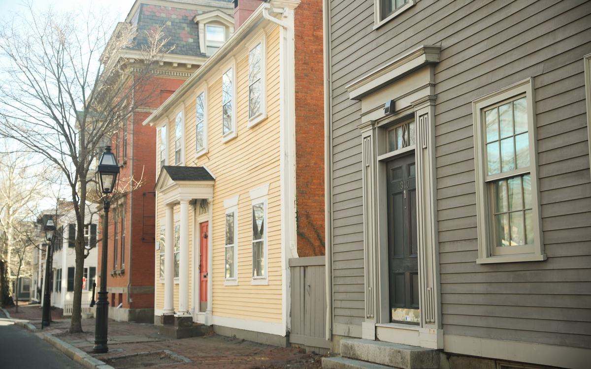 Historic New England townhouse with freshly painted trim and detailed woodwork