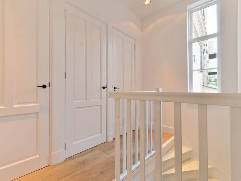 Freshly painted white interior door and trim in a Seacoast home
